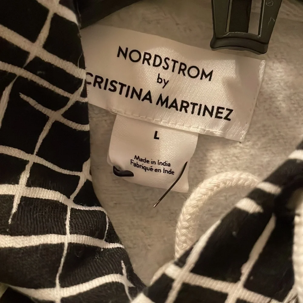 𝅺CRISTINA MARTINEZ GENDER INCLUSIVE GRAPHIC FLEECE HOODIE IN BLACK LADDE…